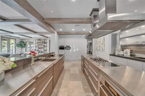 a kitchen with counter top space a sink and cabinets