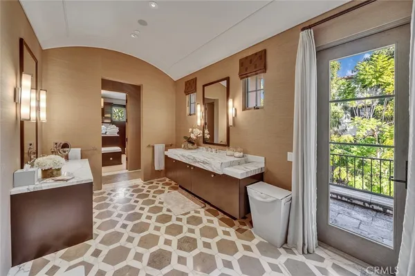 a large bathroom with a granite countertop sink a mirror and a shower
