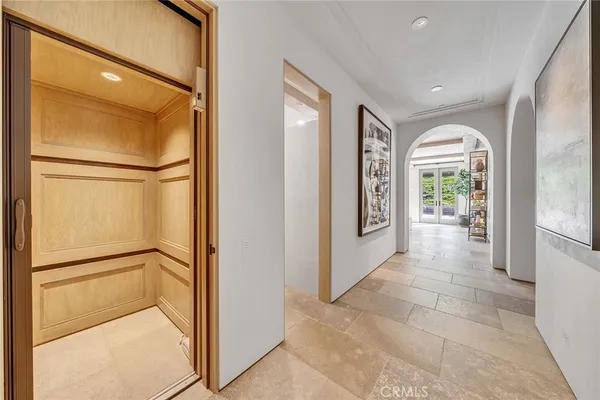 a view of entryway with window and hallway
