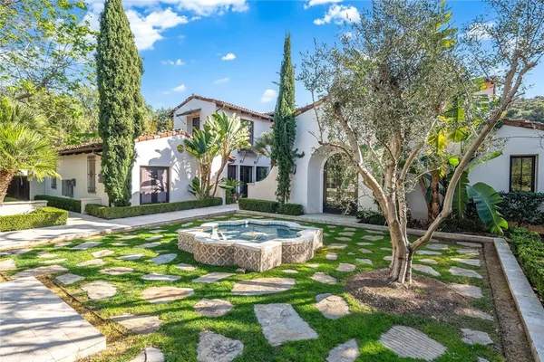 a view of a backyard with sitting area