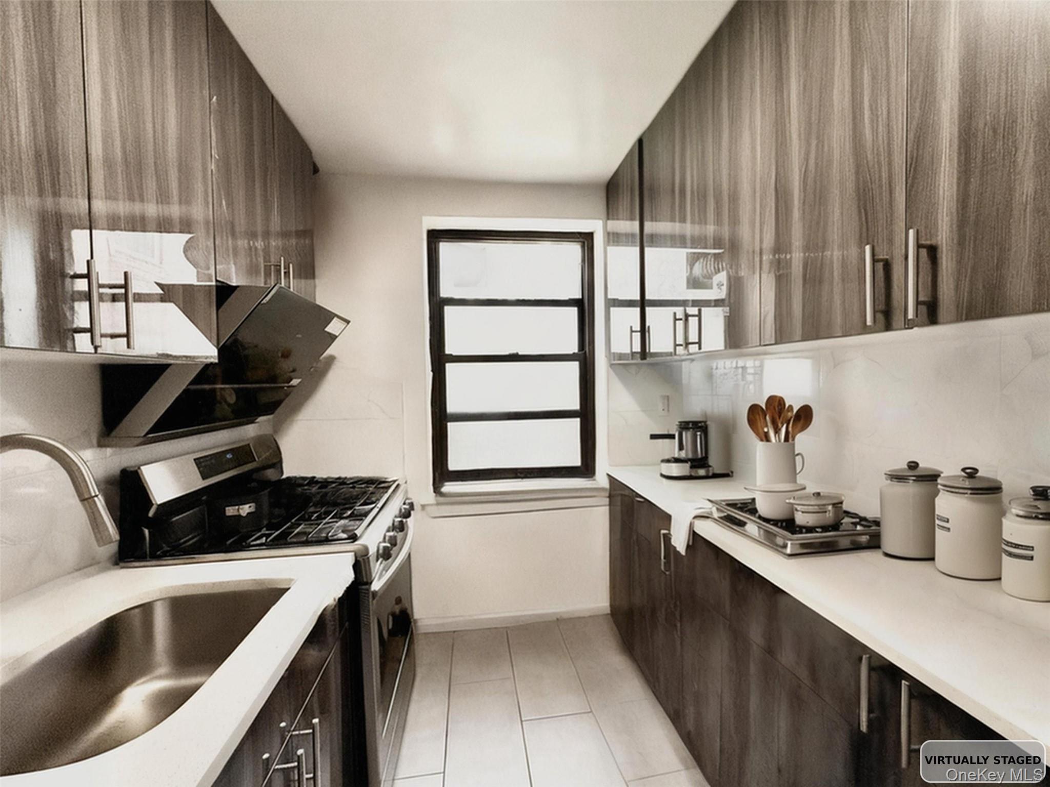 138-12 28th Road, Unit 1F Queens, NY 11354 - Photo 4 of 8 a kitchen with a sink cabinets and appliances