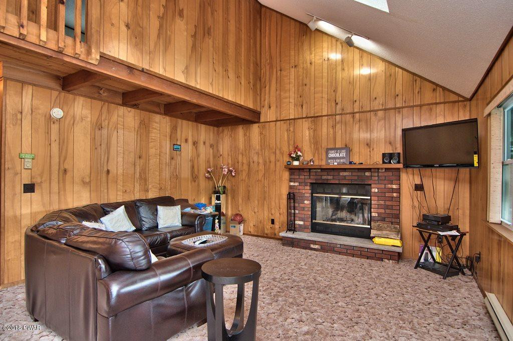 2327 Brookfield Road Lake Ariel, PA 18436 - Photo 3 of 53 a living room with furniture a flat screen tv and rug