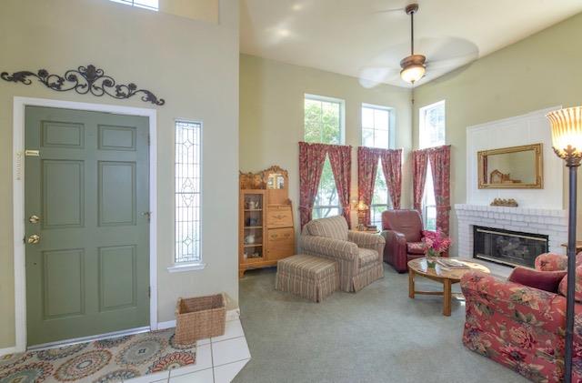 1230 Minarets Avenue Clovis, CA 93611 - Photo 13 of 19 a living room with furniture and a fireplace