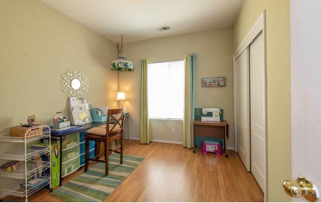 1230 Minarets Avenue Clovis, CA 93611 - Photo 16 of 19 a living room with furniture and a wooden floor