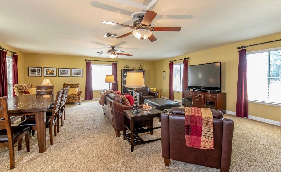 1230 Minarets Avenue Clovis, CA 93611 - Photo 8 of 19 a living room with furniture and a flat screen tv