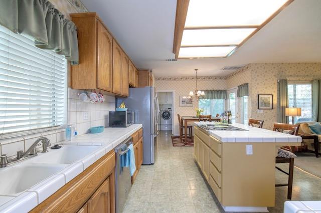 1230 Minarets Avenue Clovis, CA 93611 - Photo 10 of 19 a kitchen with stainless steel appliances granite countertop a sink stove and cabinets