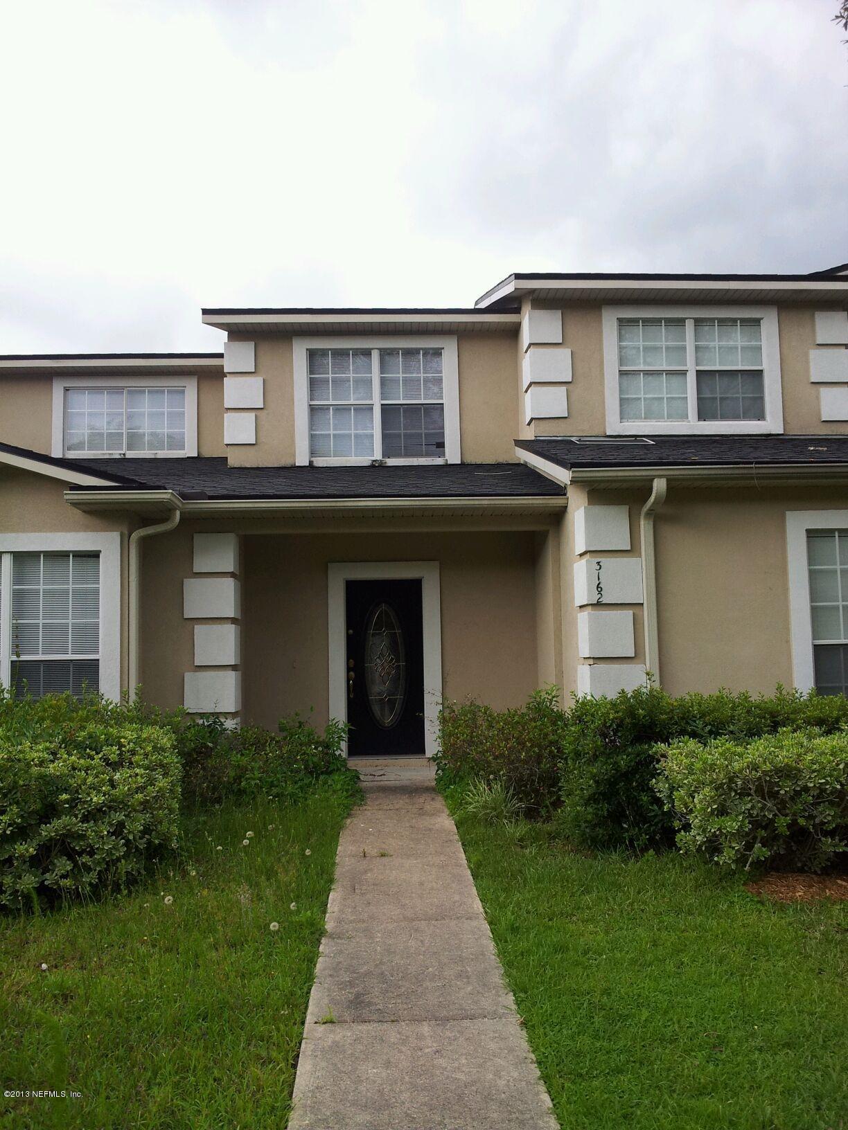 3162 Ravines Road Middleburg, FL 32068 - Photo 1 of 16 a house view with a garden space