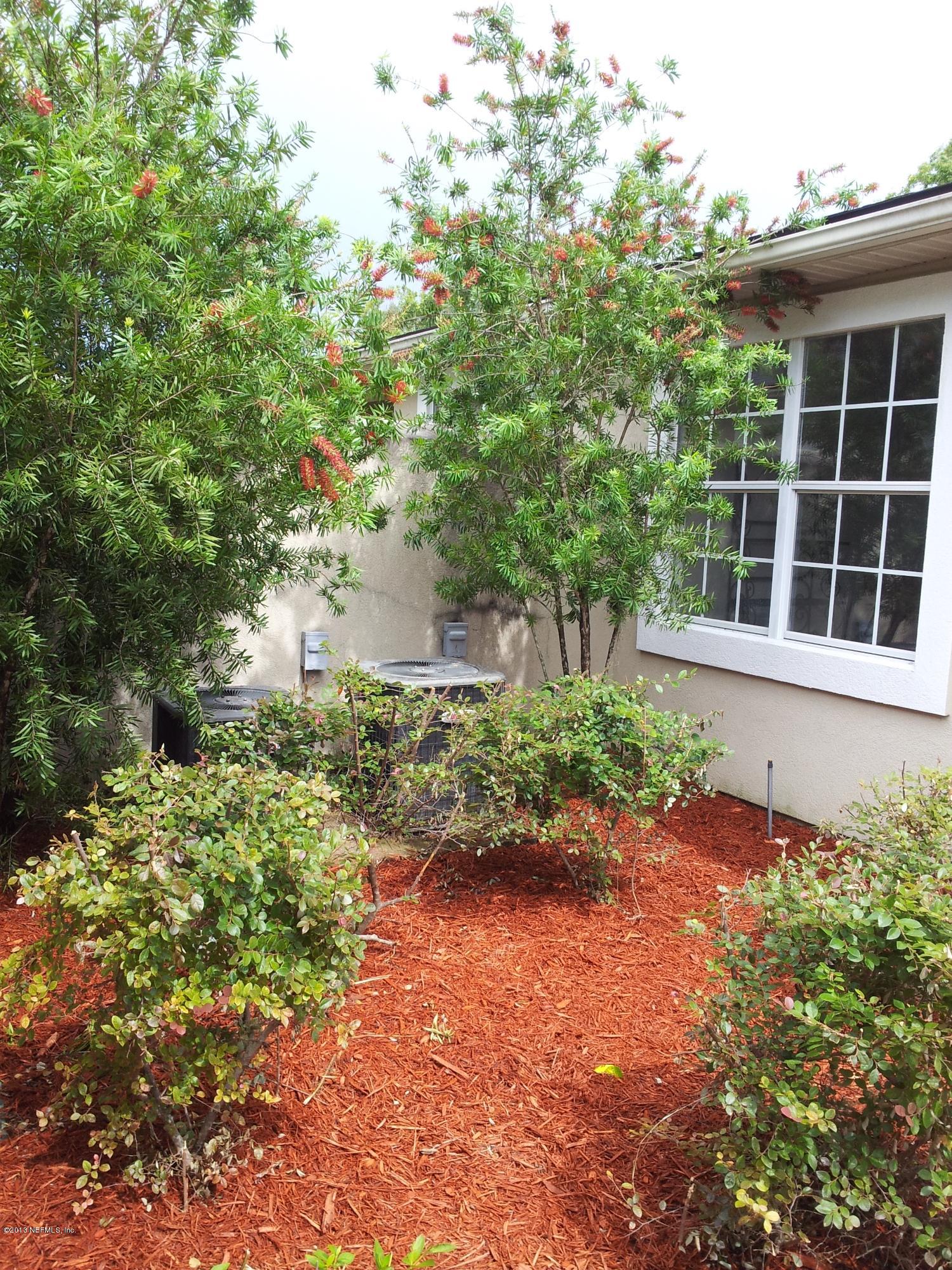 3162 Ravines Road Middleburg, FL 32068 - Photo 14 of 16 a front view of a house with a yard