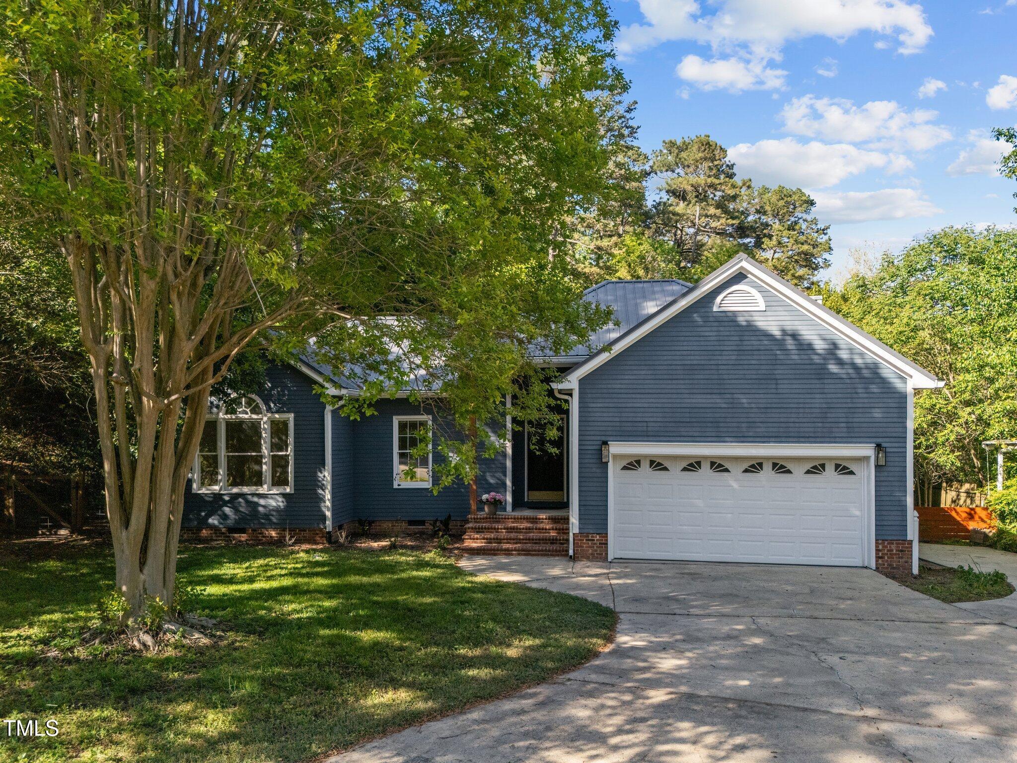 2123 Fountain Ridge Road Chapel Hill, NC 27707 - Photo 1 of 46 a view of a house with a yard and large tree