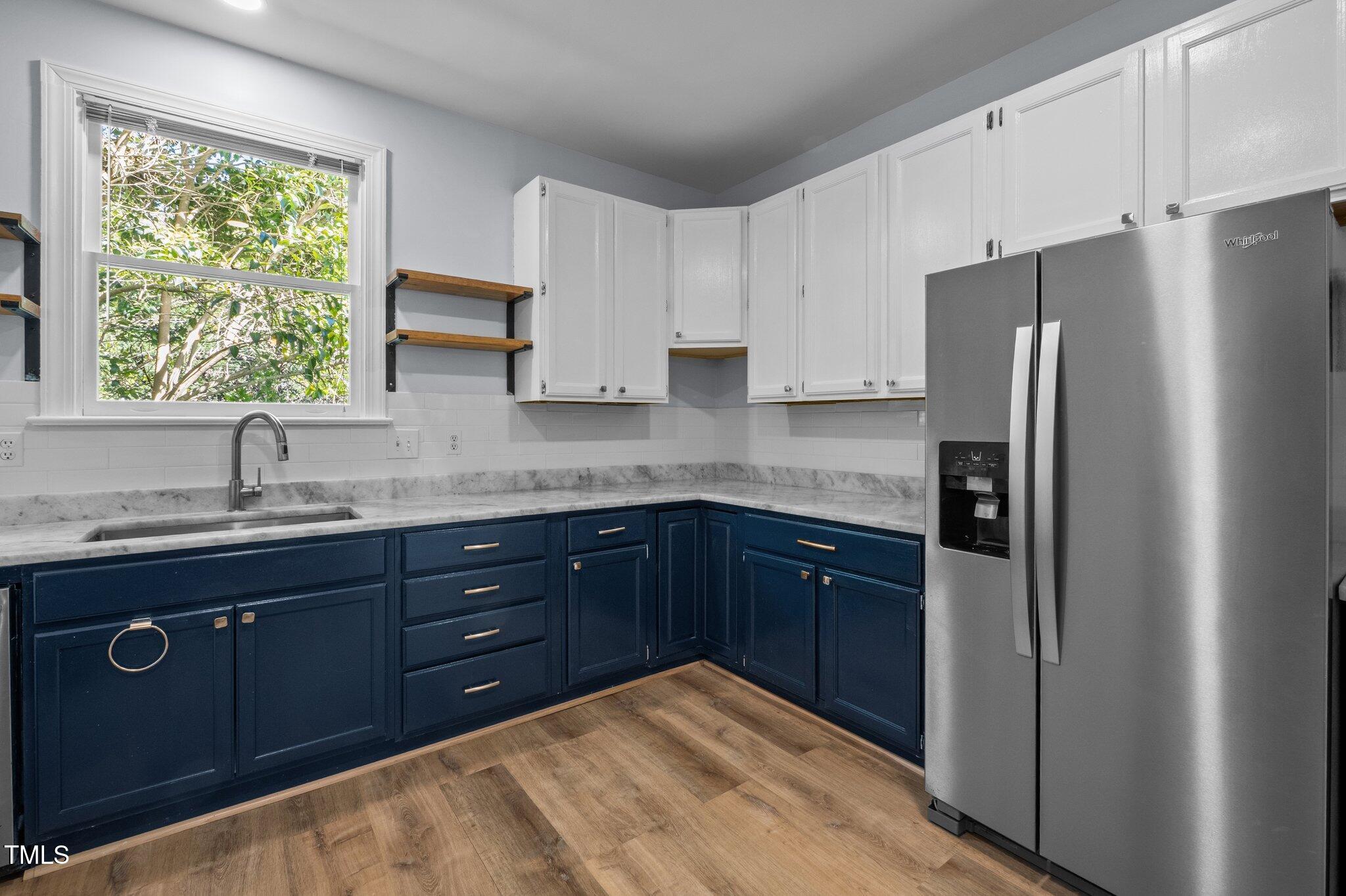 2123 Fountain Ridge Road Chapel Hill, NC 27707 - Photo 12 of 46 a kitchen with stainless steel appliances granite countertop a refrigerator and sink