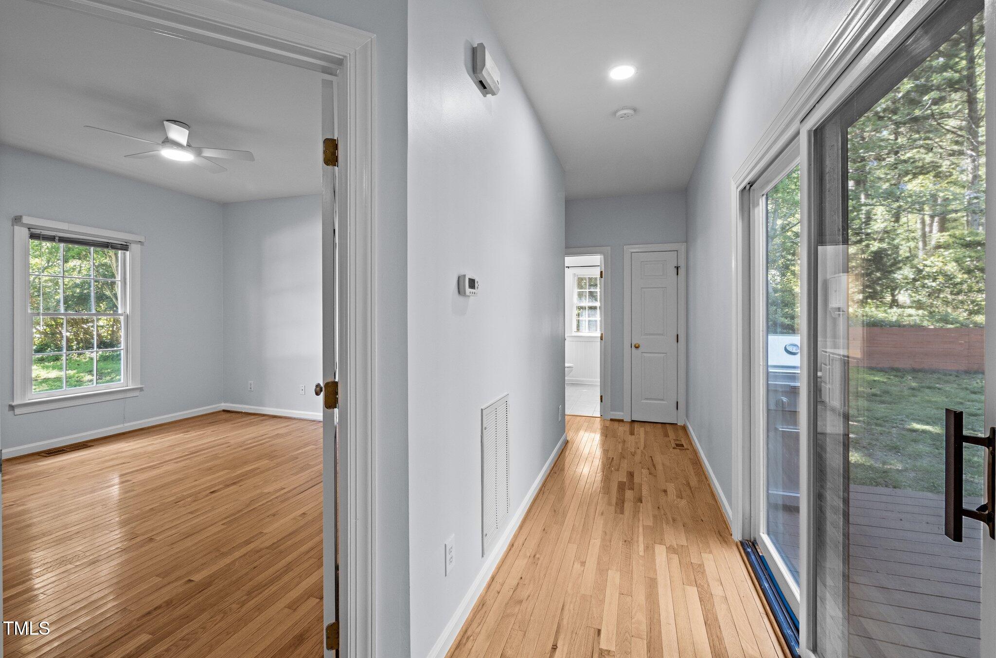2123 Fountain Ridge Road Chapel Hill, NC 27707 - Photo 22 of 46 a view of a hallway with wooden floor and staircase