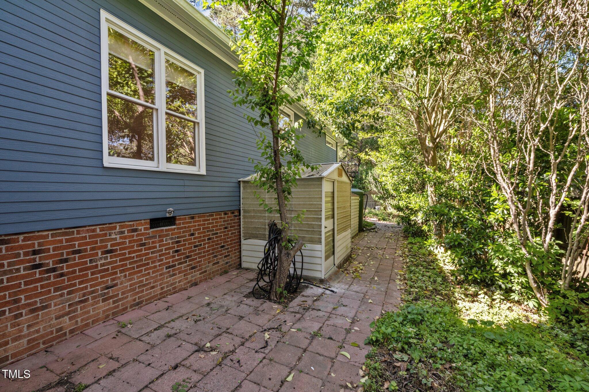 2123 Fountain Ridge Road Chapel Hill, NC 27707 - Photo 35 of 46 a view of a pathway besides a building