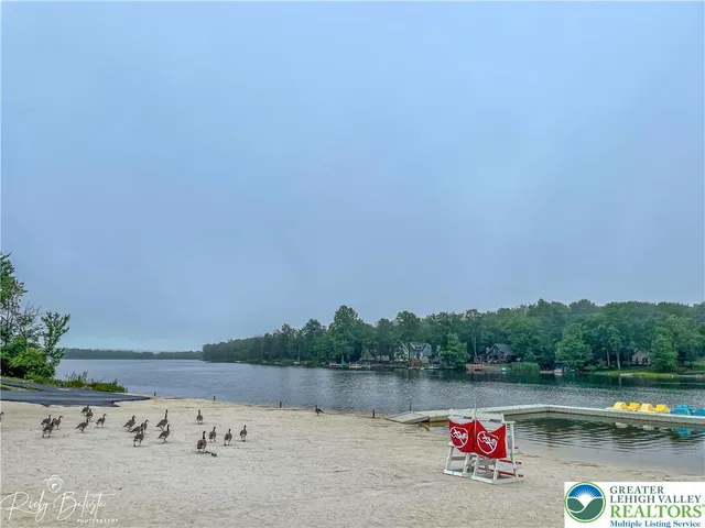 a view of a lake with a car parked