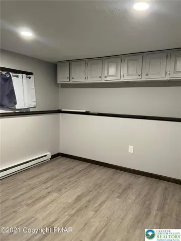 a living room with hard wood floors