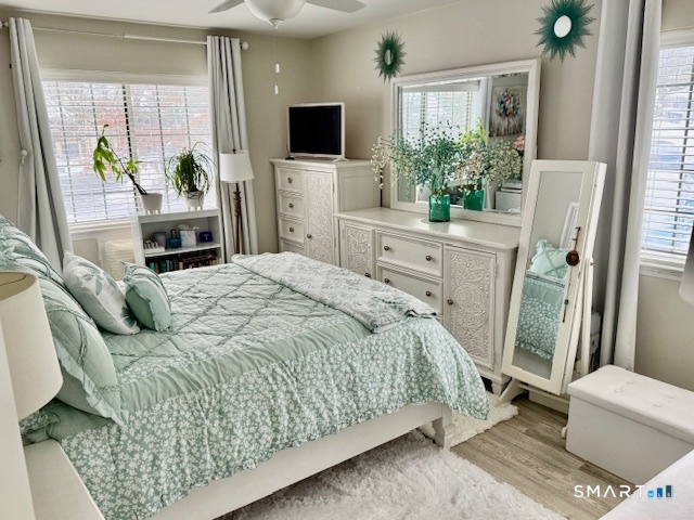 4 Arlington Court, Unit 4 Brookfield, CT 06804 - Photo 17 of 21 a bedroom with a bed and a flat screen tv