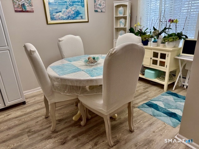 4 Arlington Court, Unit 4 Brookfield, CT 06804 - Photo 9 of 21 a living room with furniture and wooden floor