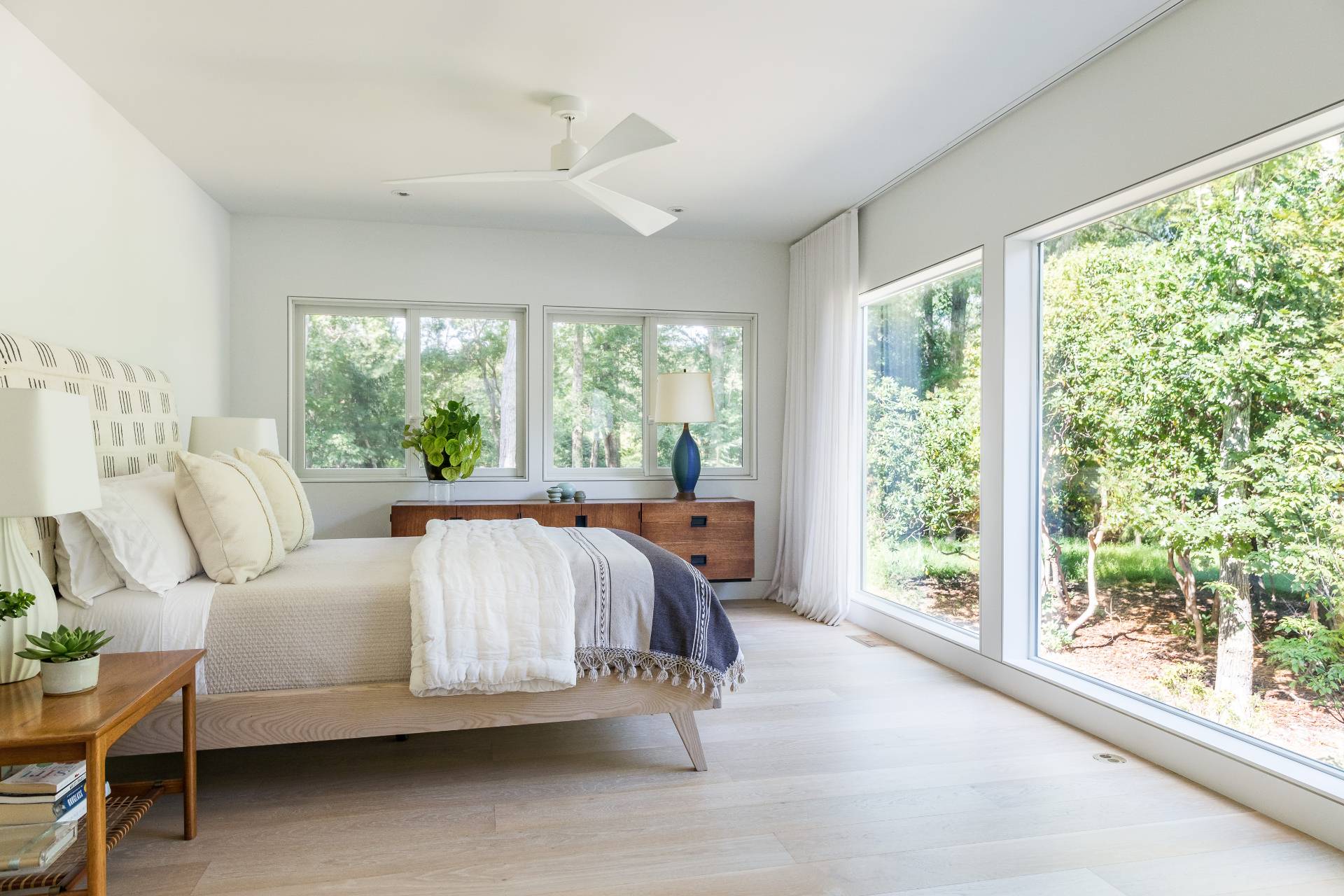 216 Bull Path East Hampton, NY 11937 - Photo 11 of 30 a bedroom with a bed and a large window