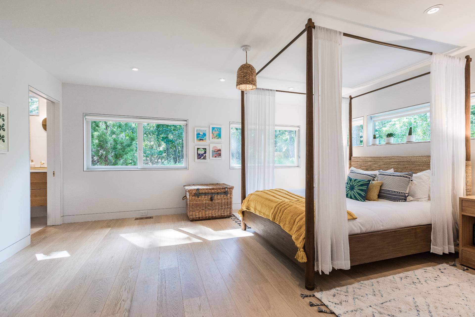 216 Bull Path East Hampton, NY 11937 - Photo 18 of 30 a bedroom with a bed and wooden floor