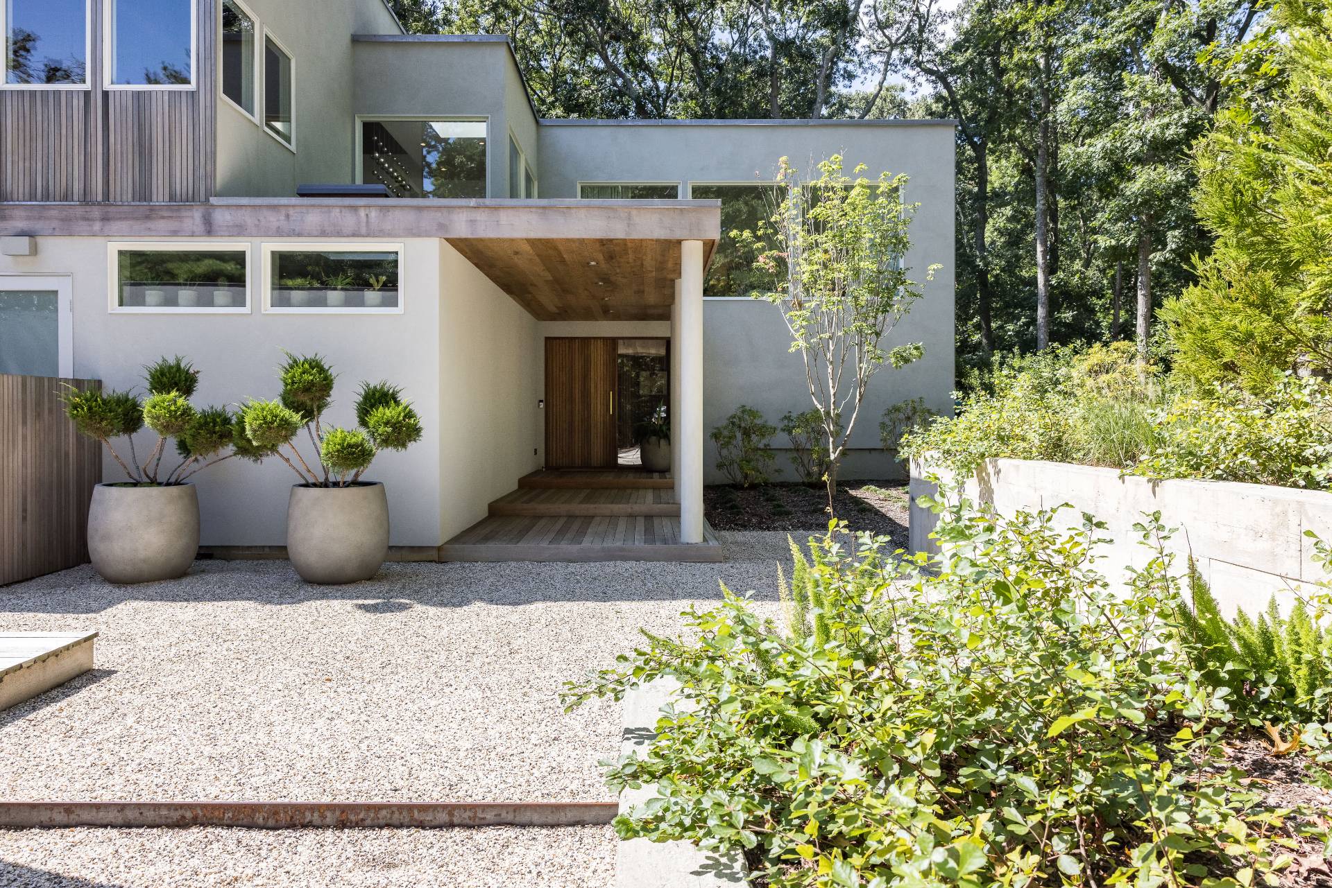 216 Bull Path East Hampton, NY 11937 - Photo 3 of 30 a view of a house with potted plants