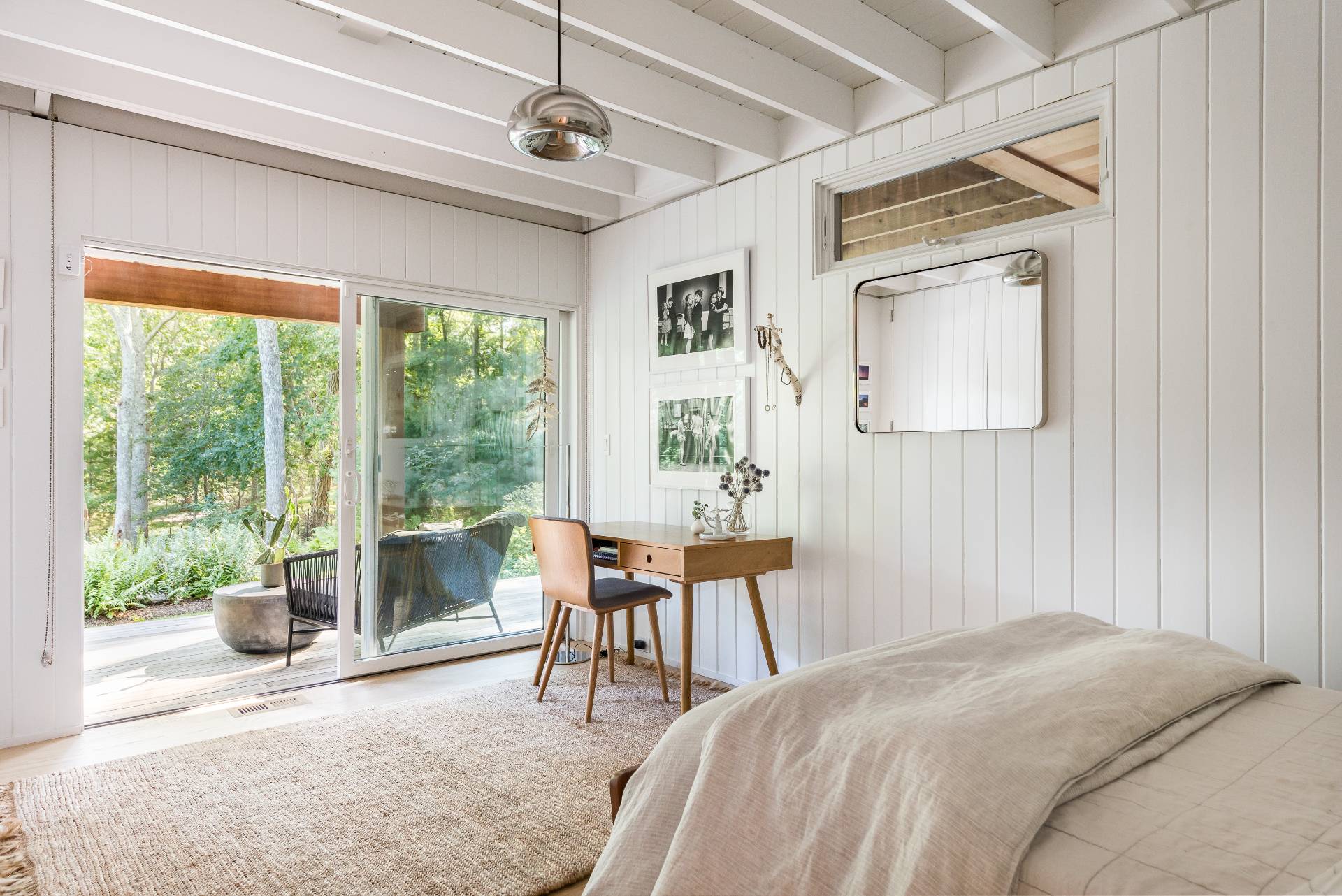 216 Bull Path East Hampton, NY 11937 - Photo 21 of 30 a bedroom with a bed and a chair