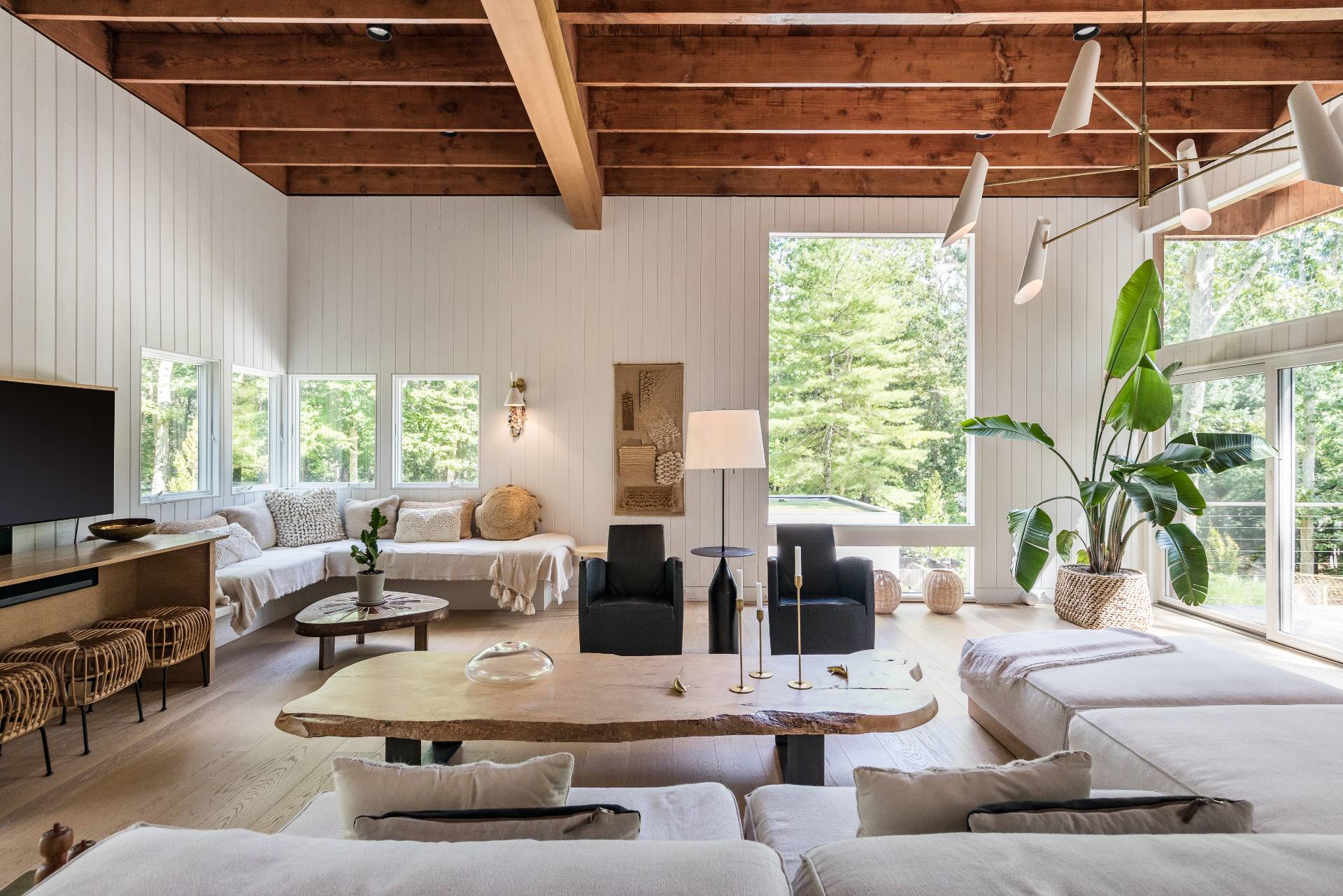 216 Bull Path East Hampton, NY 11937 - Photo 4 of 30 a living room with furniture and a flat screen tv