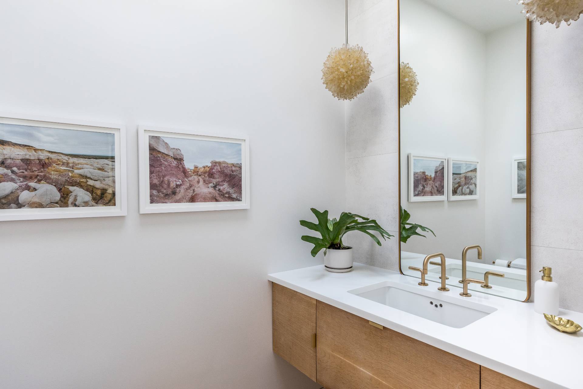 216 Bull Path East Hampton, NY 11937 - Photo 9 of 30 a bathroom with a sink a mirror and vanity