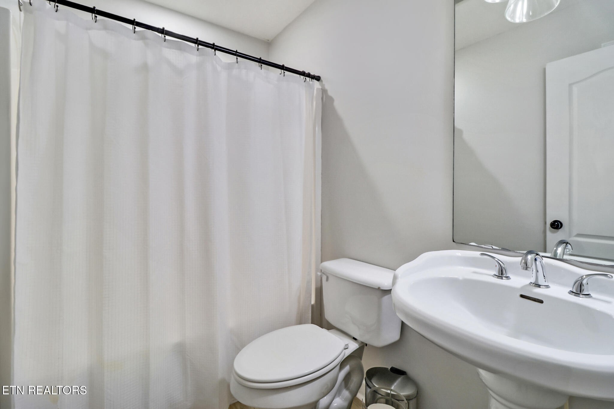 93 Tower Way Allardt, TN 38504 - Photo 16 of 40 a white toilet sitting next to a bathroom sink