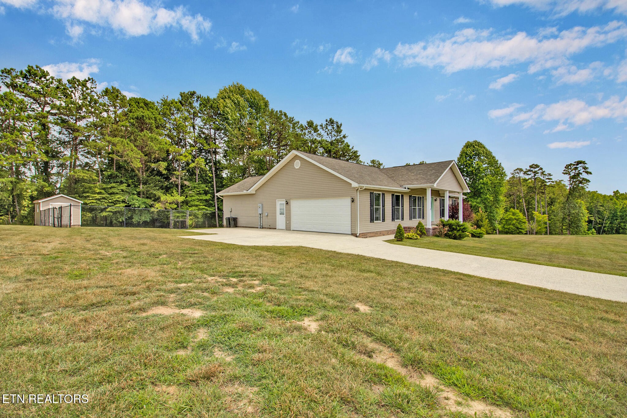 93 Tower Way Allardt, TN 38504 - Photo 8 of 40 a white house with a big yard and large tree