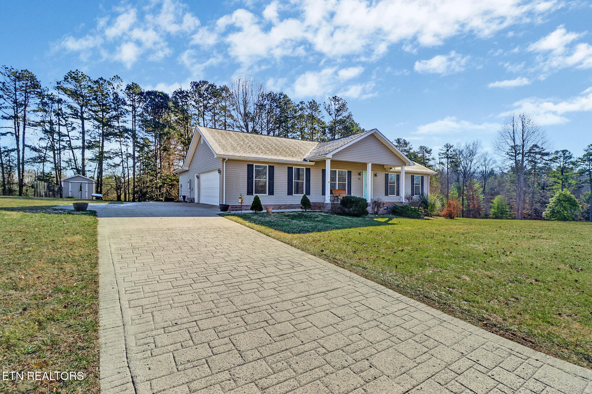 93 Tower Way Allardt, TN 38504 - Photo 9 of 40 a front view of a house with a yard and trees