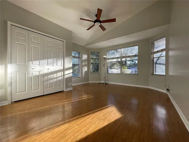 a view of an empty room with a window