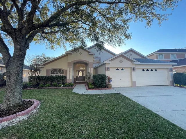a front view of a house with a yard and porch