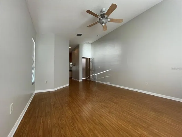 a view of a livingroom with wooden floor
