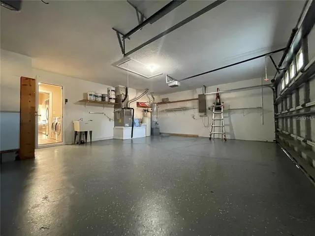 a view of a livingroom with furniture and a window