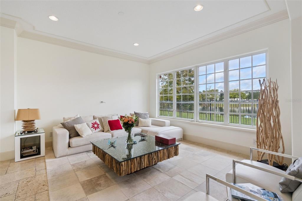 103 Acadia Terrace Celebration, FL 34747 - Photo 11 of 87 a living room with furniture and a large window