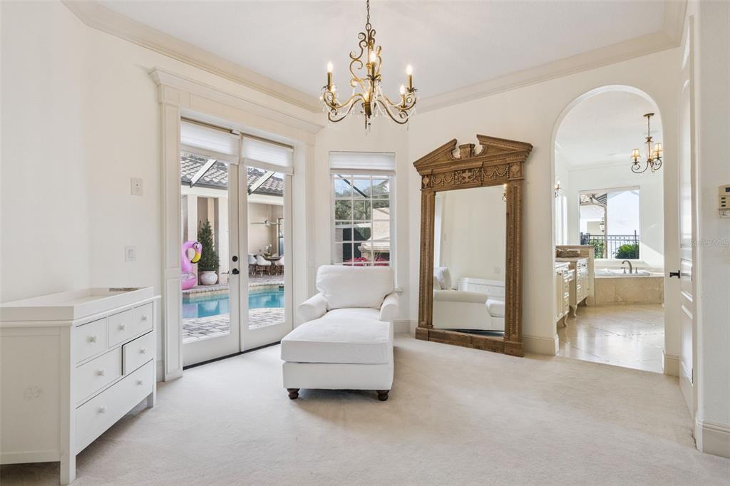 103 Acadia Terrace Celebration, FL 34747 - Photo 29 of 87 a living room with furniture and a chandelier