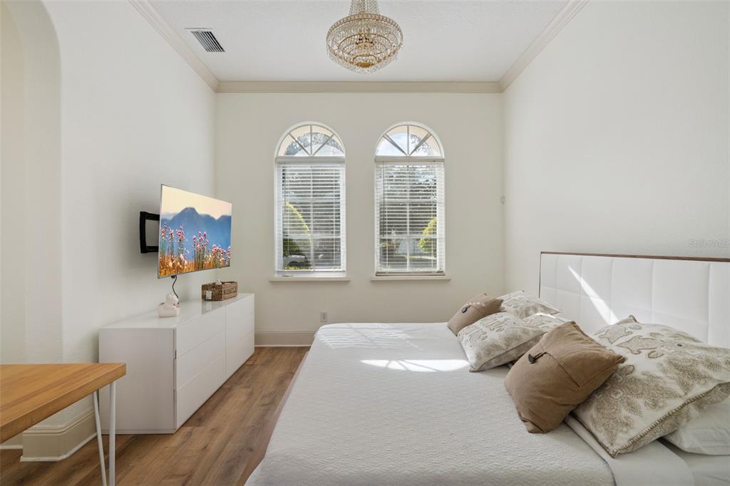 103 Acadia Terrace Celebration, FL 34747 - Photo 30 of 87 a bedroom with a bed and a window