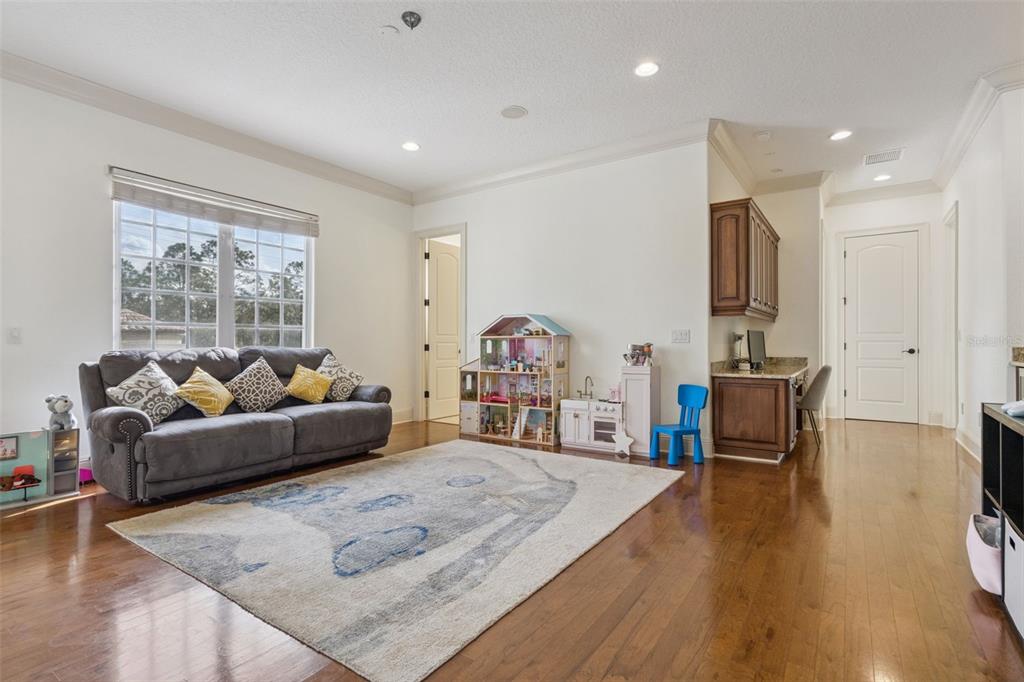 103 Acadia Terrace Celebration, FL 34747 - Photo 35 of 87 a living room with furniture and a flat screen tv