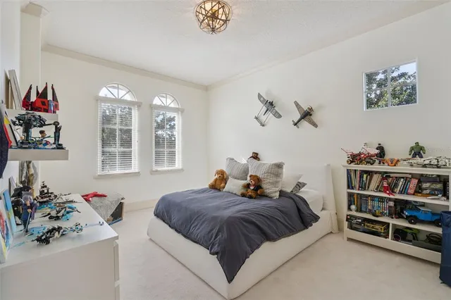 an aerial view of a house with garden space and street view