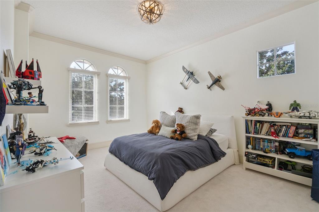 103 Acadia Terrace Celebration, FL 34747 - Photo 39 of 87 a bed room with a bed and a window