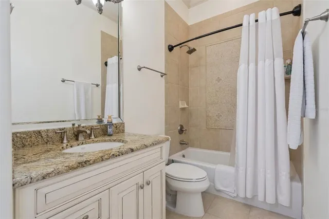 an aerial view of a residential houses with outdoor space