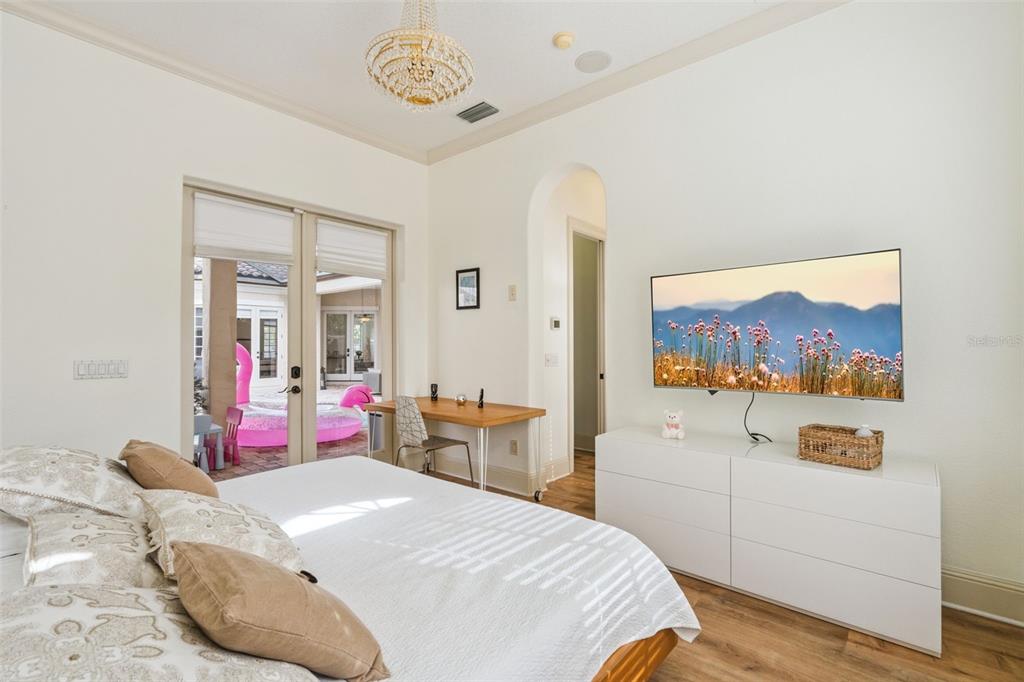 103 Acadia Terrace Celebration, FL 34747 - Photo 42 of 87 a bedroom with a bed and a dresser