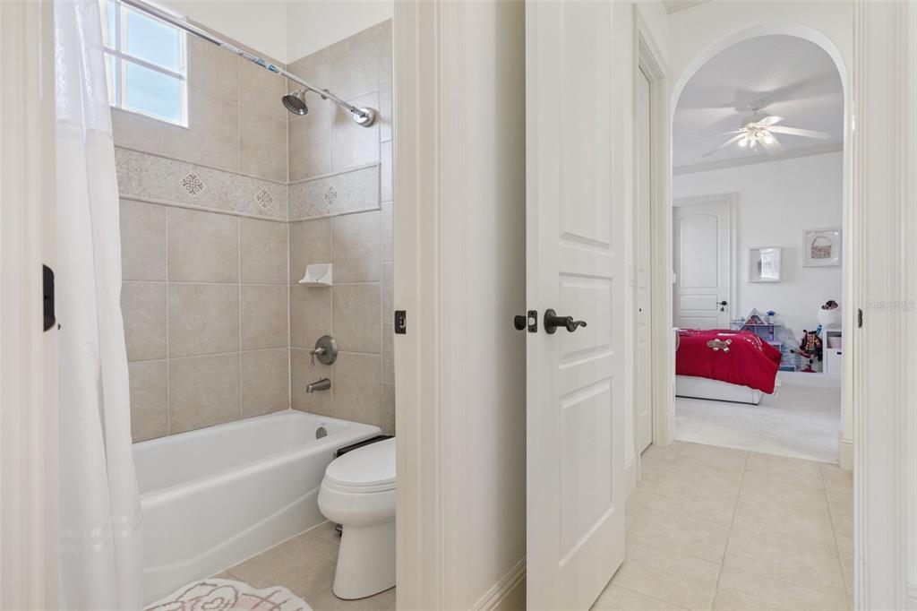 103 Acadia Terrace Celebration, FL 34747 - Photo 46 of 87 a bathroom with a sink a toilet and shower