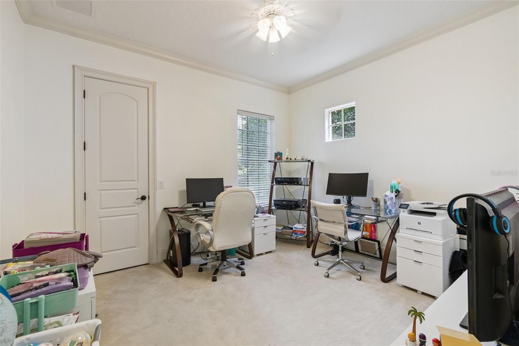 103 Acadia Terrace Celebration, FL 34747 - Photo 50 of 87 a view of a workspace with furniture and a window