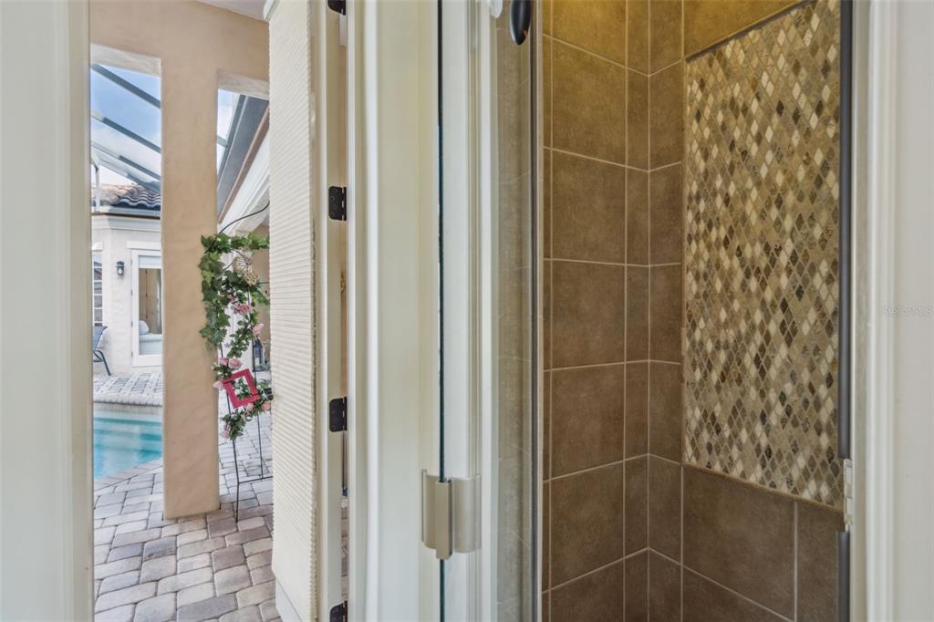 103 Acadia Terrace Celebration, FL 34747 - Photo 51 of 87 a bathroom with a shower and a mirror