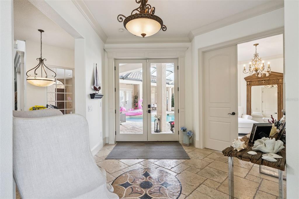 103 Acadia Terrace Celebration, FL 34747 - Photo 6 of 87 a very nice looking room with a large window and chandelier