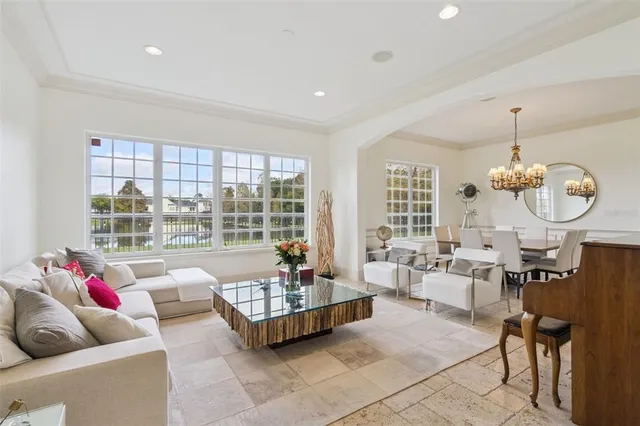 a view of a dining room with furniture wooden floor and chandelier