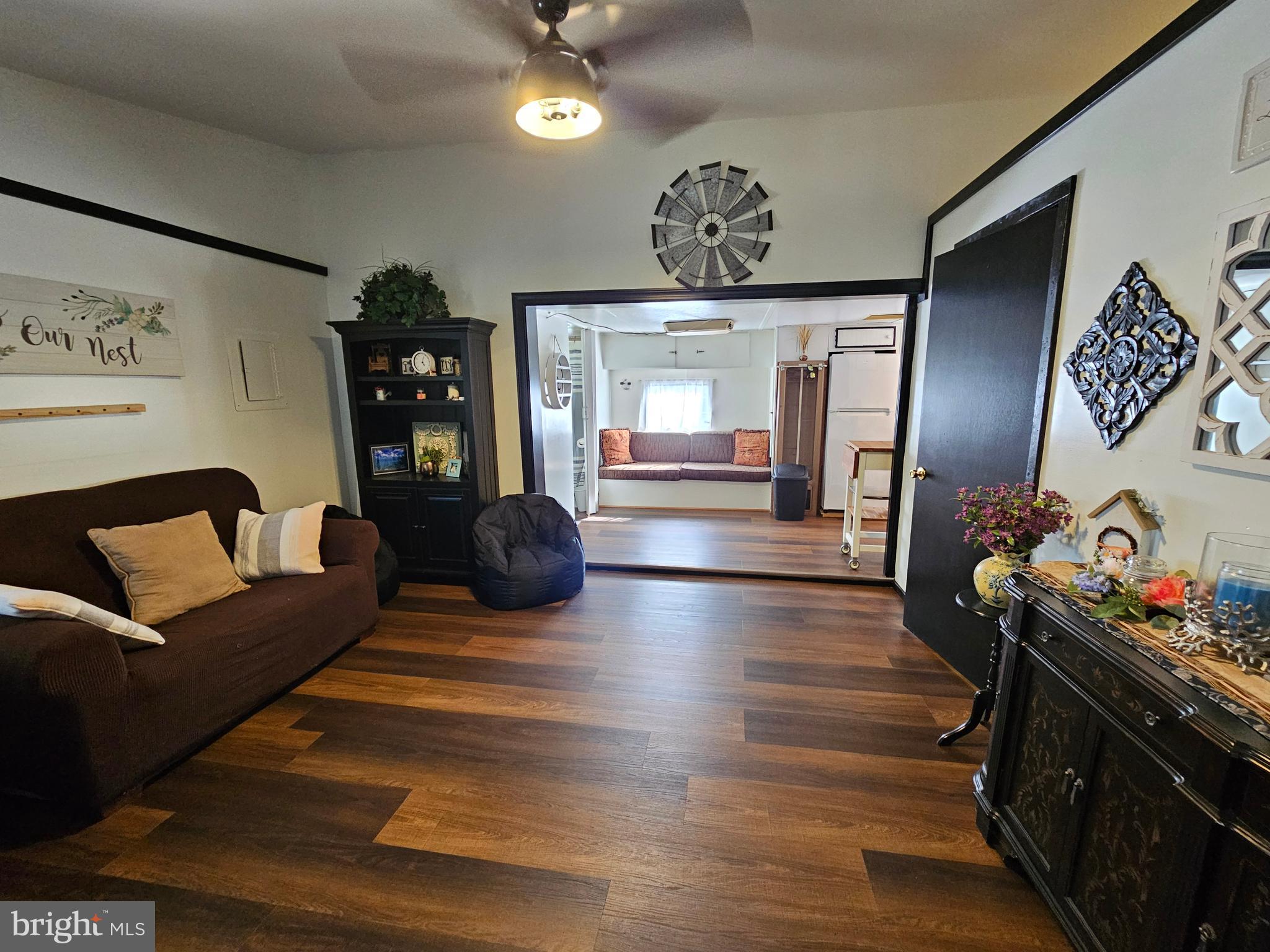 4 Old Faceful Street Falling Waters, WV 25419 - Photo 11 of 32 a living room with furniture and wooden floor