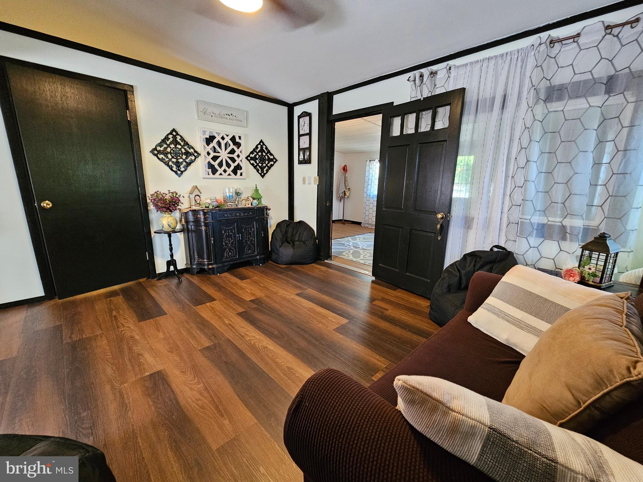 4 Old Faceful Street Falling Waters, WV 25419 - Photo 3 of 32 a bedroom with a bed dresser and a large mirror