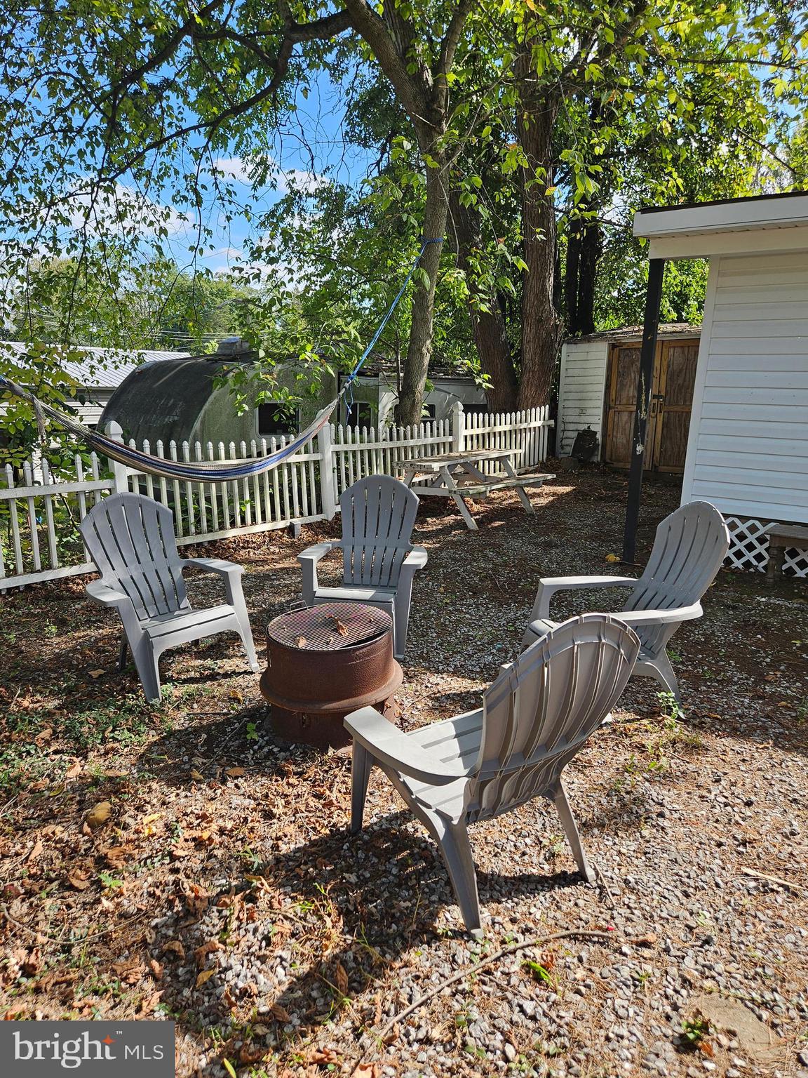 4 Old Faceful Street Falling Waters, WV 25419 - Photo 6 of 32 a view of a chairs and table in backyard