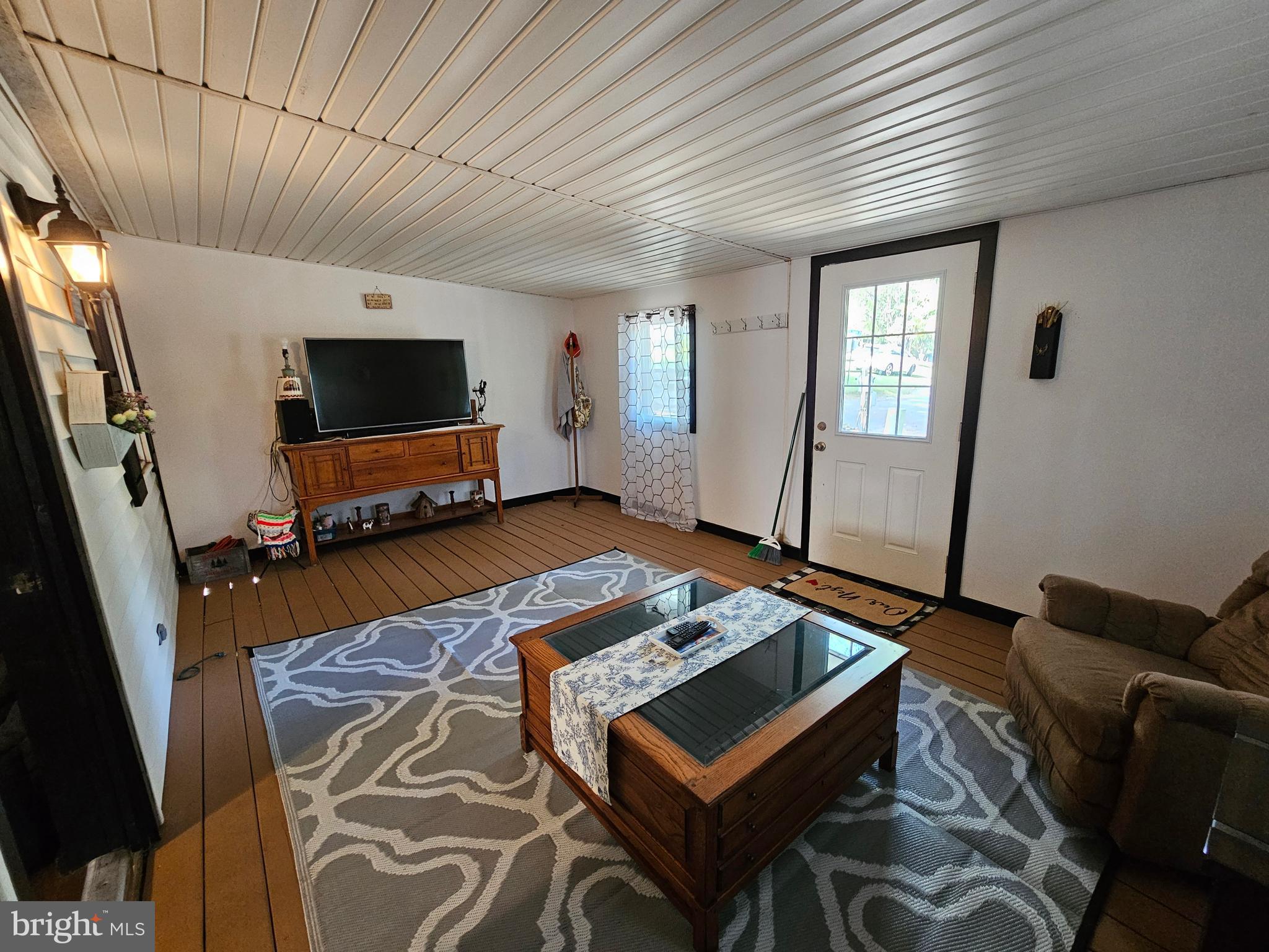 4 Old Faceful Street Falling Waters, WV 25419 - Photo 8 of 32 a living room with furniture and a flat screen tv